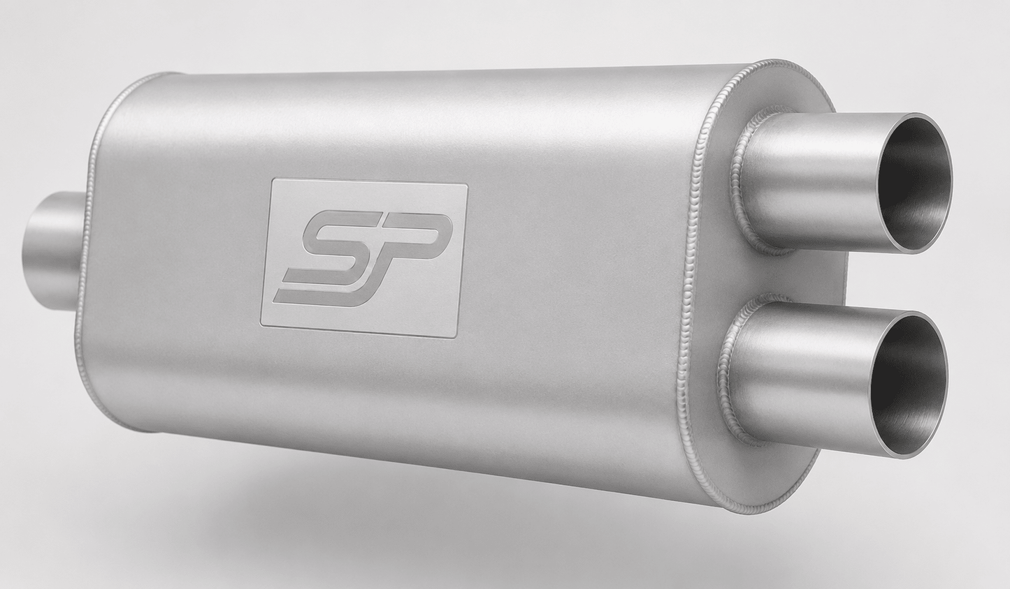 A silver metallic automotive exhaust muffler with dual outlet pipes and a square logo plate on the side, shown on a light gray background.
