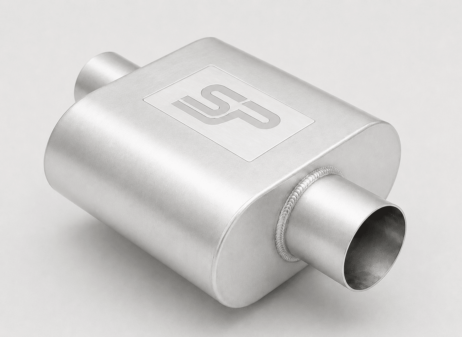 A silver metallic exhaust muffler with a brushed finish, featuring a square-shaped body, cylindrical inlet and outlet pipes, and a white square logo plate on top.
